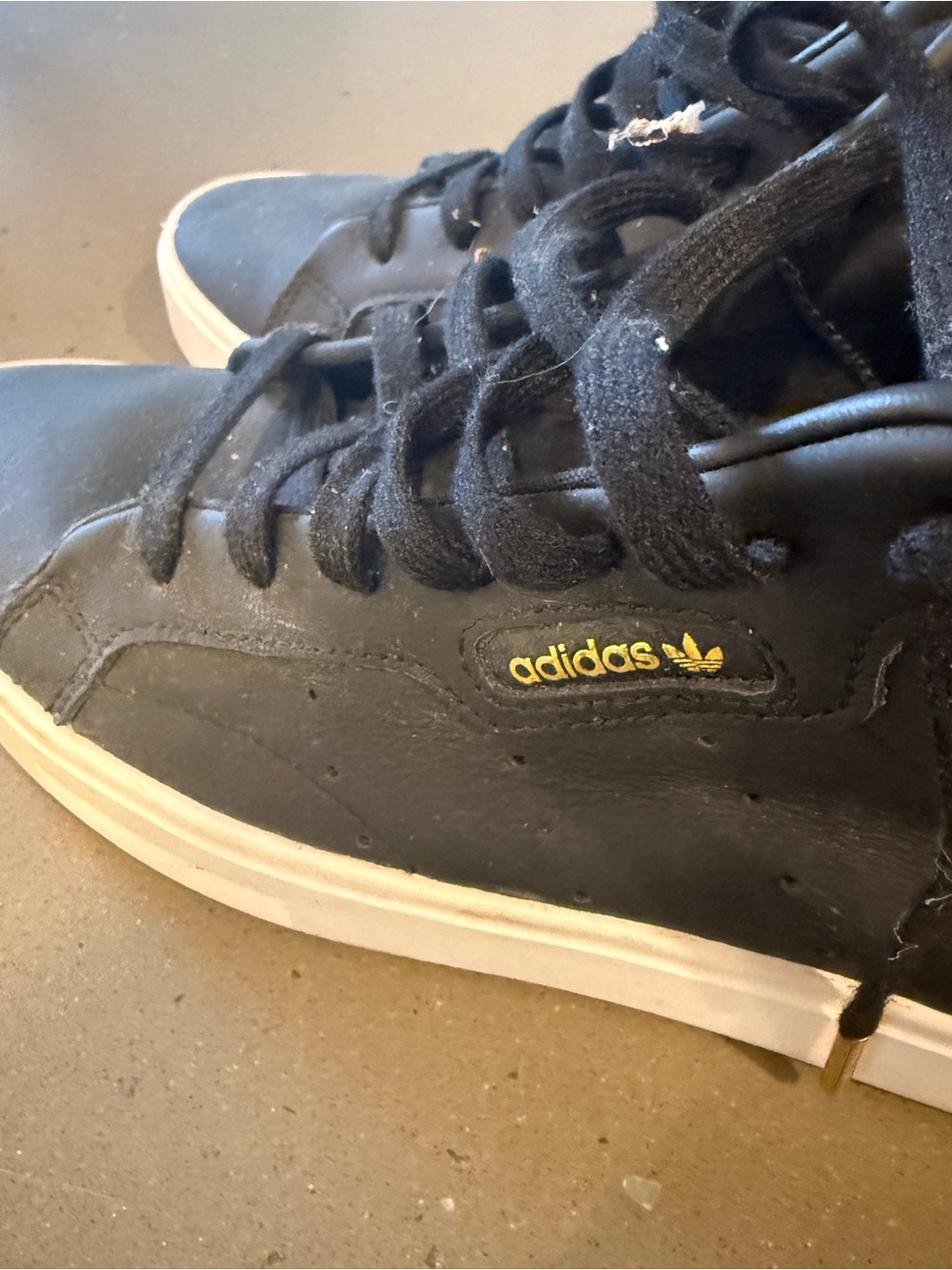 adidas Black Sneakers with Gold Logo Accent
